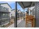 Exterior shot of a balcony with outdoor furniture and a view of other units at 5189 Vivian St, Wheat Ridge, CO 80033