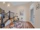 Cozy entryway with hardwood floors, a staircase, and a seating area at 5189 Vivian St, Wheat Ridge, CO 80033