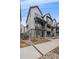 Street view of modern townhomes with stylish facades and well-maintained landscaping at 5189 Vivian St, Wheat Ridge, CO 80033
