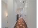 Upstairs hallway with hardwood floors, white walls, and access to bedrooms and bathrooms at 5189 Vivian St, Wheat Ridge, CO 80033