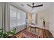 Well-lit home office with large windows, desk, and stylish rug at 5189 Vivian St, Wheat Ridge, CO 80033