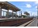 Exterior of a train station with covered platforms and tracks stretching into the distance at 5189 Vivian St, Wheat Ridge, CO 80033