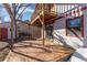 Backyard with two-story wooden deck, perfect for outdoor relaxation and entertaining with space for seating and dining at 11970 W Pleasant Ave, Lakewood, CO 80401