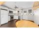 Bright kitchen with white cabinets, stainless steel appliances and ceiling fan at 11970 W Pleasant Ave, Lakewood, CO 80401