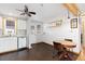 Bright kitchen with white cabinets, stainless steel appliances and ceiling fan at 11970 W Pleasant Ave, Lakewood, CO 80401