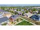 Aerial view of neighborhood featuring green lawns and mountain backdrop at 13711 Ash Cir, Thornton, CO 80602