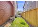 Backyard featuring a grass area with gravel and a wood fence at 13711 Ash Cir, Thornton, CO 80602
