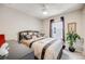 Comfortable bedroom featuring a ceiling fan, carpet, and natural light at 13711 Ash Cir, Thornton, CO 80602