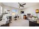 Bedroom featuring a ceiling fan, two desks, and natural light at 13711 Ash Cir, Thornton, CO 80602