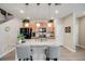 Bright kitchen features a granite island, stainless appliances, and wood cabinets at 13711 Ash Cir, Thornton, CO 80602