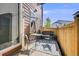 Outdoor patio featuring a small seating area with fence for privacy at 13711 Ash Cir, Thornton, CO 80602