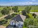 Charming home featuring a well-maintained roof, lush landscaping, and scenic views of the surrounding greenery and mountains at 14798 N 115Th St, Longmont, CO 80504