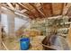 Barn interior with exposed wooden beams and bales of hay, showcasing rustic charm and ample storage capacity at 14798 N 115Th St, Longmont, CO 80504