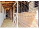 Barn with multiple stalls, filled with hay, offering a rustic and functional space for livestock and storage at 14798 N 115Th St, Longmont, CO 80504