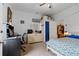 Cozy bedroom features a ceiling fan, light colored walls, an a closet space for storage and organization at 14798 N 115Th St, Longmont, CO 80504