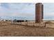 Rustic farm and paddock featuring a brick silo with overcast sky at 14798 N 115Th St, Longmont, CO 80504