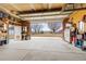 Large garage with door open offers a view of the property's surrounding landscape and ample natural light at 14798 N 115Th St, Longmont, CO 80504