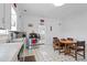 Functional kitchen with classic black and white flooring, appliances, and a cozy dining area at 14798 N 115Th St, Longmont, CO 80504
