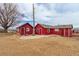 Exterior shot showcases two small outbuildings on a lot with mature trees and gravel landscaping at 14798 N 115Th St, Longmont, CO 80504