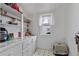 Pantry with ample storage space with cabinets, shelves, and window allowing plenty of natural light to brighten the area at 14798 N 115Th St, Longmont, CO 80504