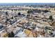 An aerial view captures a residential neighborhood with tree-lined streets and a mix of house styles at 3180 S Albion St, Denver, CO 80222