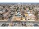 An aerial view showcases a neighborhood with a mix of homes and tree-lined streets at 3180 S Albion St, Denver, CO 80222