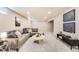 Finished basement featuring a comfortable sectional, stylish decor, and ample living space for relaxation at 3180 S Albion St, Denver, CO 80222