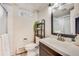 Updated bathroom featuring a sleek vanity, modern fixtures, and a walk-in shower with neutral accents at 3180 S Albion St, Denver, CO 80222