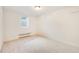 A well-lit bedroom features neutral walls, carpet flooring, and a window for natural light at 3180 S Albion St, Denver, CO 80222