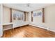 Spacious bedroom with hardwood floors, bright windows, built-in storage and an abundance of natural light at 3180 S Albion St, Denver, CO 80222