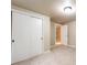 Bedroom with neutral carpeting, a closet for storage and an adjacent staircase leading to another level at 3180 S Albion St, Denver, CO 80222