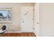 Bright entryway with wood floors and a charming front door and closet at 3180 S Albion St, Denver, CO 80222