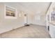 Covered outdoor patio is a bright space with tiled floors and modern lighting at 3180 S Albion St, Denver, CO 80222