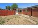 Charming brick home with a well-kept yard and a cozy front porch at 3581 Olive St, Denver, CO 80207