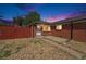 Charming brick home with a well-kept yard and a cozy front porch at 3581 Olive St, Denver, CO 80207