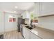 Bright kitchen with stainless steel appliances and modern countertops at 3581 Olive St, Denver, CO 80207
