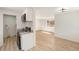 Cozy kitchen adjacent to living area with new appliances at 3581 Olive St, Denver, CO 80207