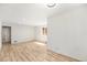 Bright living room featuring sleek wood floors and abundant natural light at 3581 Olive St, Denver, CO 80207