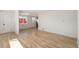Open living area featuring wood floors, neutral paint, and natural light at 3581 Olive St, Denver, CO 80207