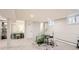 Finished basement with a music area, desk space, and bright lighting creating a versatile living space at 3842 S Quebec St, Denver, CO 80237