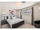 Relaxing bedroom with a comfortable queen-size bed, soft white linens, and a cozy gray area rug at 3842 S Quebec St, Denver, CO 80237