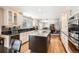 Beautiful kitchen featuring granite countertops, ample cabinet space, and stainless-steel appliances throughout at 3842 S Quebec St, Denver, CO 80237