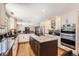 Well-equipped kitchen with a large island, stainless steel appliances, and plenty of counter space at 3842 S Quebec St, Denver, CO 80237