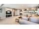 Spacious living area with built-in entertainment center and comfortable seating, perfect for relaxation at 3842 S Quebec St, Denver, CO 80237