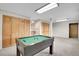 Finished basement features a billiards table and extra storage cabinets at 25704 Shiloh, Conifer, CO 80433