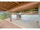 Covered patio with wood accents and panoramic views, perfect for outdoor relaxation at 25704 Shiloh, Conifer, CO 80433