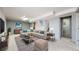 Finished basement area with a cozy seating area, a large TV, and soft carpet at 7818 Florado St, Denver, CO 80221