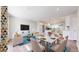 Inviting living area connected to the dining space and kitchen, perfect for entertaining at 7818 Florado St, Denver, CO 80221