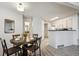 Open concept dining room with modern light fixture and easy access to the kitchen at 4804 E Kentucky Ave # D, Denver, CO 80246