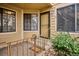Charming entrance with wrought iron railings, covered landing and freshly painted door at 4804 E Kentucky Ave # D, Denver, CO 80246
